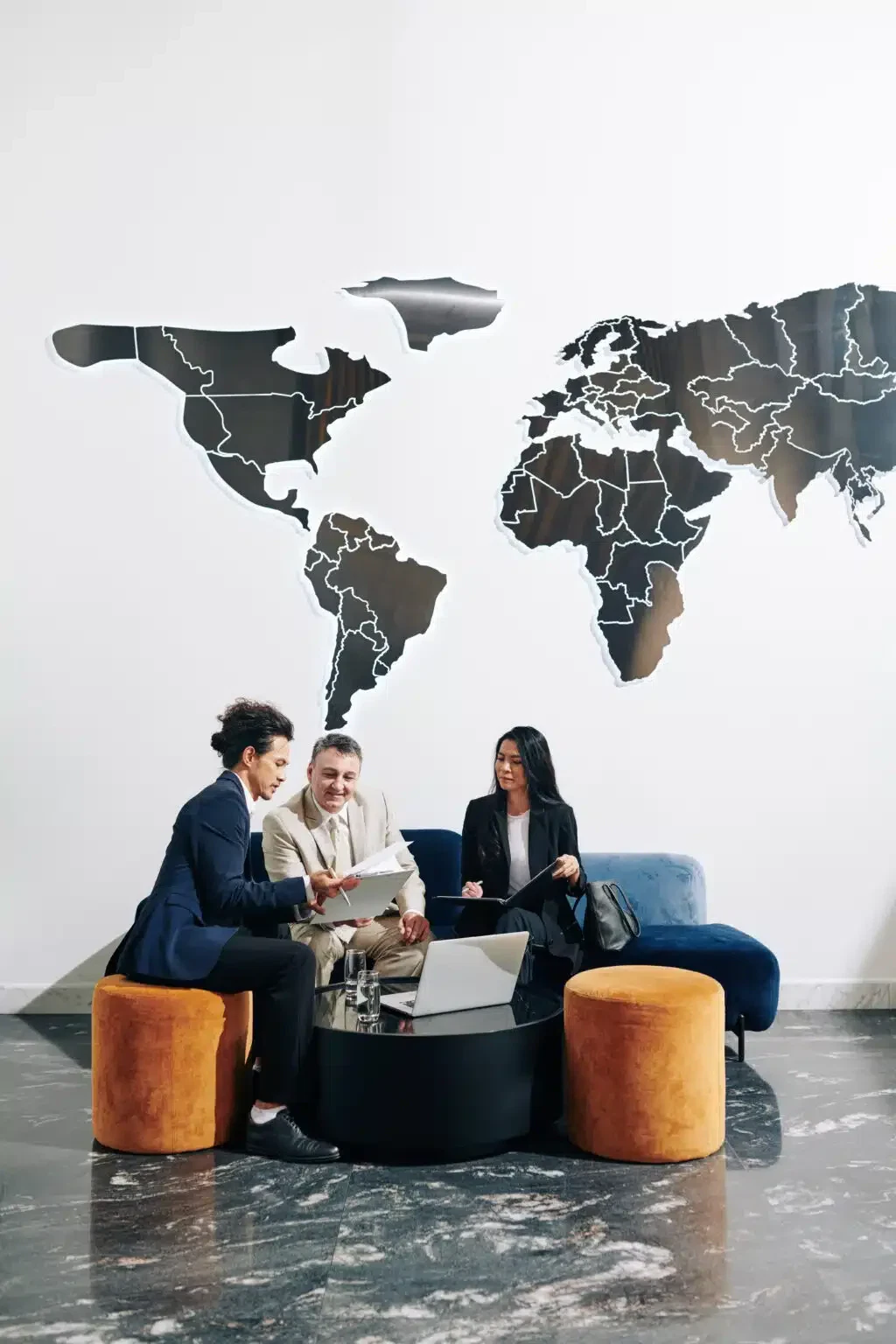 Group of milti-ethnic business people discussing charts and diagrams at meeting